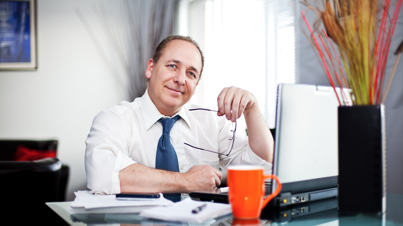 Man sitting at desk.