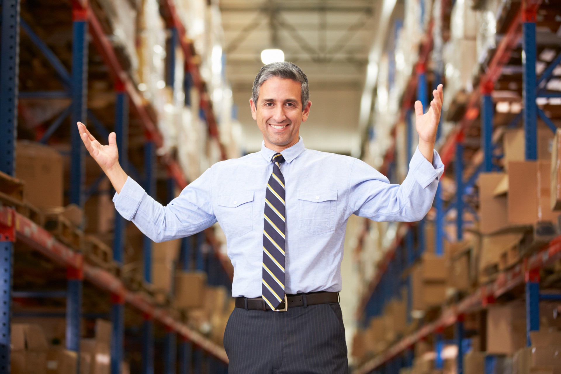 Man standing in warehouse.